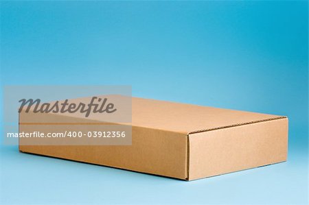 Cardboard box on blue background