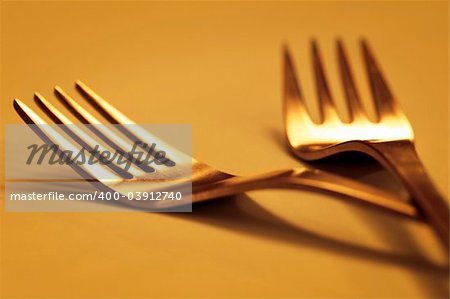 forks isolated on gold