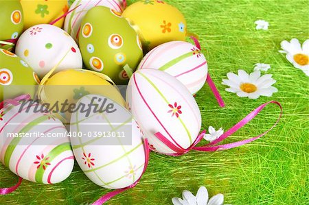 Painted Colorful Easter Eggs on green Grass