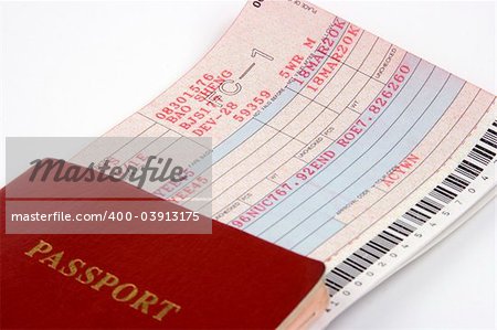 Close up of passport and airline ticket.