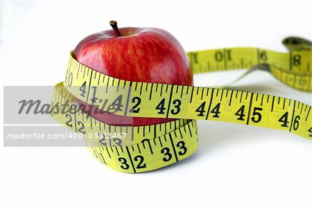 Apple with measuring tape around in white background