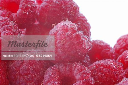 Raspberries covered in water drops