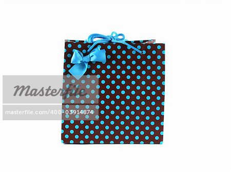 Brown and blue spotted gift bag isolated on white.
