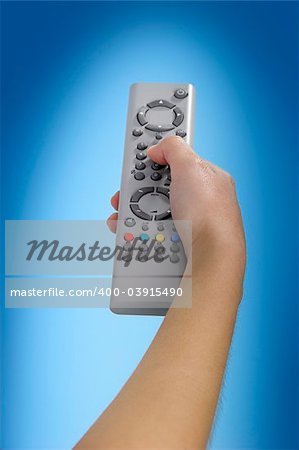 Human hand olding a tv remote control