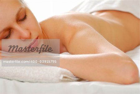 Woman with towel. Soft focus, shallow depth of field.