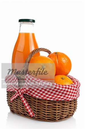 Three oranges and one bottle of fresh juice in a basket reflected on white background