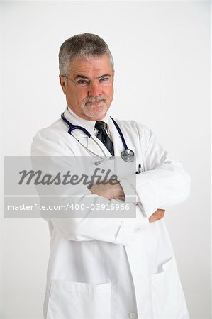 Doctor wearing a white lab coat with arm crossed with a disbelieving expression