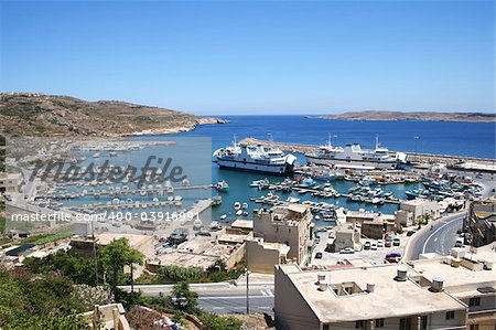 A panorama view of Mgarr port with ferry on Gozo island, Malta.