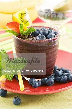 A glass of blueberry smoothie