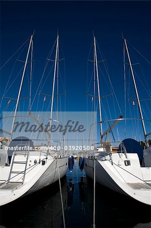 boats anchored in a harbour on a sunny day