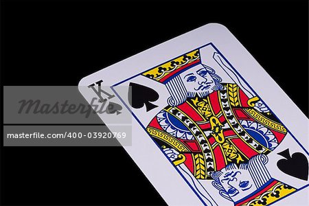 A poker card slanted view over black background