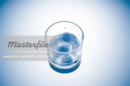 Cold Glass of Sparkling Mineral Water with Ice.