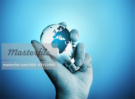 A man holding a bulb with the world on it.