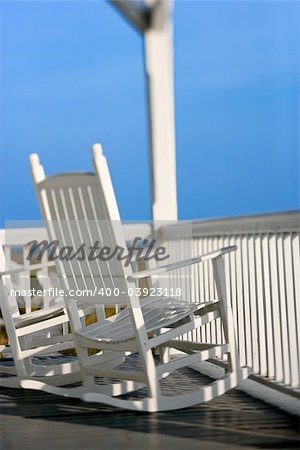 Rocking chairs on porch on Bald Head Island, North Carolina.