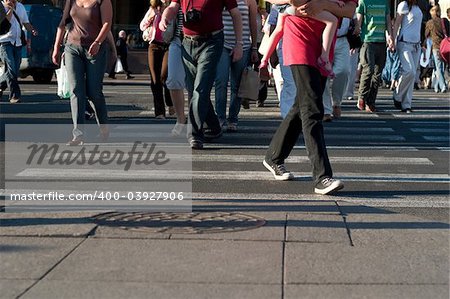 Pedestrians crossing a street of big city