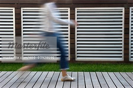 A motion blur abstract of a person walking in a hurry