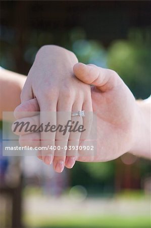 A newly engaged couple showing off the engagement ring