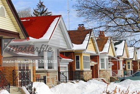 Row of residential houses in winter with snow