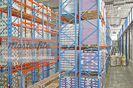 Big warehouse storage room with boxes and shelves