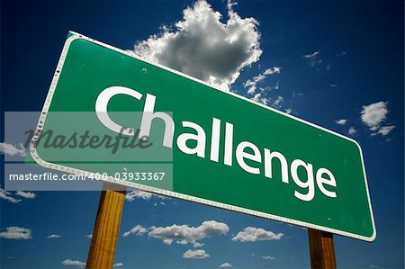 "Challenge" Road Sign with dramatic clouds and sky.