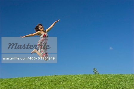 Happy woman on a beautiful green meadow