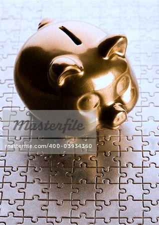 Piggy bank on jigsaws & on the colorfull background