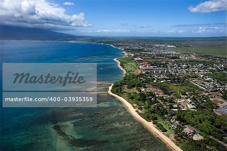 Aerial of Maui, Hawaii coastline with beach and buildings.