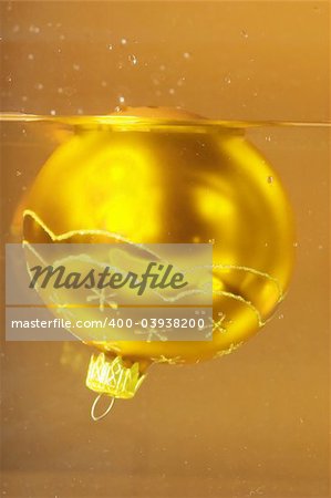 Christmas decoration made of golden ball in a water