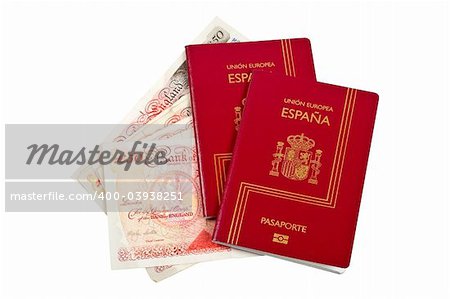 Two Spain passports and money isolated on white background. With clipping path included