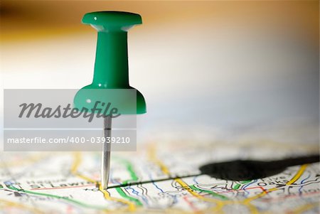 Thumbtack on a map symbol of travel destination