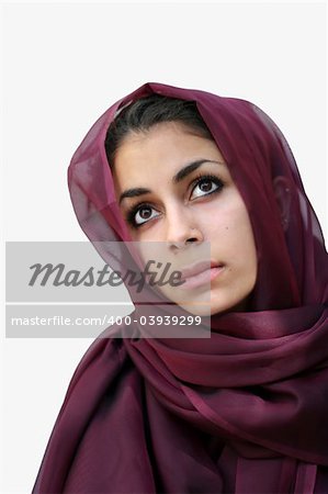 Middle eastern beauty in a scarf looking up