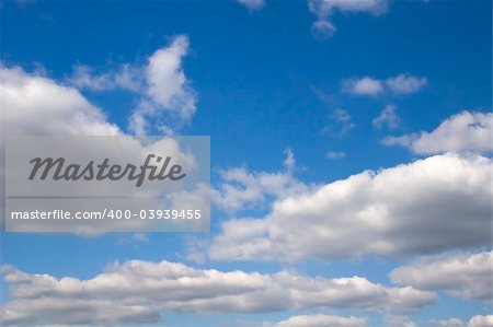 The blue sky and beautiful white clouds.