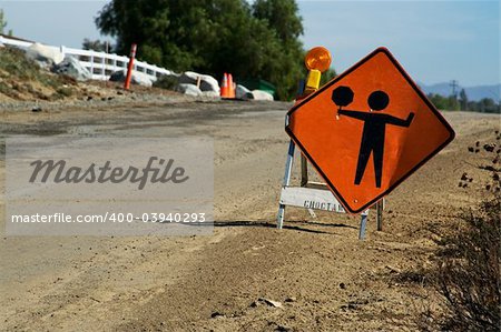 Signal ahead warning sign along the road side.