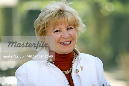 Outdoor portrait of a happy mature woman