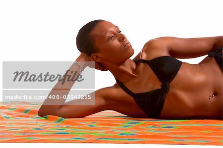 African-American female relaxing and taking sunbath (isolated)