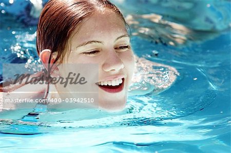 Happy girl in a pool