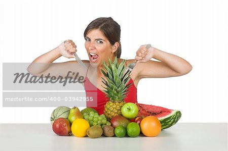 Beautiful hungry woman eating a lot of healhty fruits