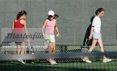 3 girls at tennis practice