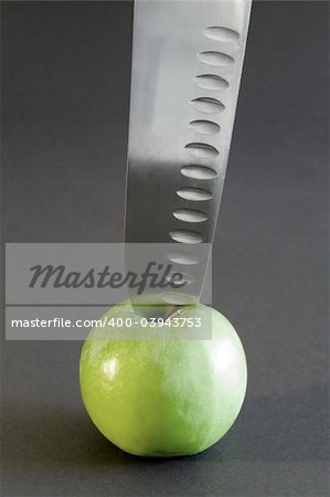 Kitchen knife and the apple