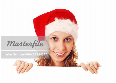 Girl in Santa's hat with a signboard, isolated on white