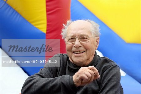 Happy senior man on a colorful background