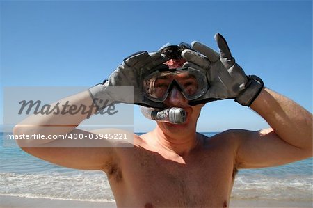 Man is about to go snorkeling in the ocean