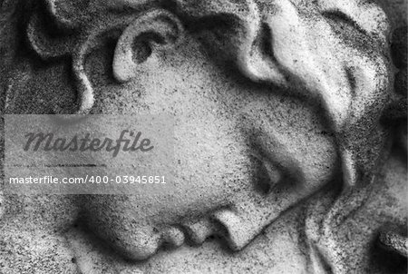 Close up of a stone carved face of an  angel