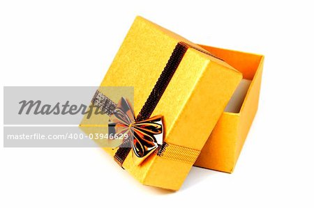 Opened gold shining gift box isolated on white.