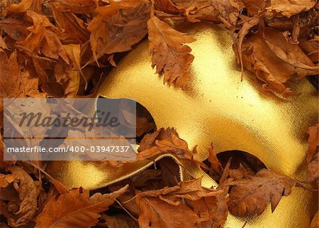 Mask and autumn leaves