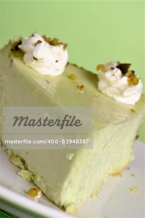 Slice of green cheesecake on plate