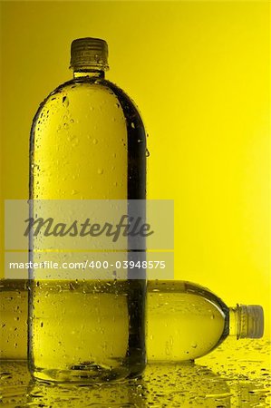 Water bottles with yellow background