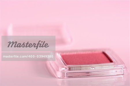 Cosmetic product close-up with pink cast