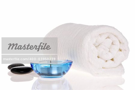 Towel, candle, and zen stones
