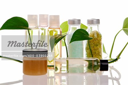 Spa bottles on white with reflection